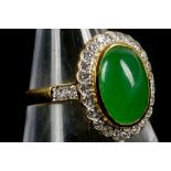 A high carat gold, cabouchon jade and diamond clus