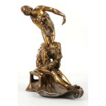An early 20th Century, bronzed vesta holder, depicting a scholar in thought with a naked female