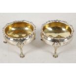 A pair of George III silver salts, with gilt interiors, raised on hoof feet, made in 1775 by