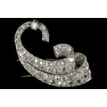 A fine Art Deco, diamond scroll brooch by Van Clee