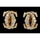 A pair of Cartier double C earrings in 18ct gold,