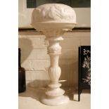 A 1920's alabaster table lamp, having a carved sha