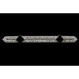 An Art Deco 18ct white gold bar brooch set with ap