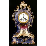 A French porcelain Paris mantel clock in Jacob Petit style, the rococo case with blue ground and