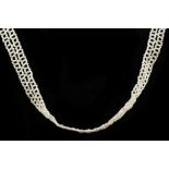 A fine, c.1900, seed pearl lattice necklace, havin