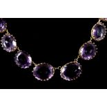 A French 18ct gold and graduated amethyst necklace