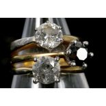 An 18k gold and diamond set 3 stone ring, composed