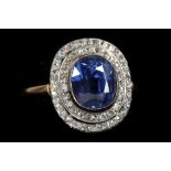 An 18ct gold, Burmese sapphire and diamond cluster