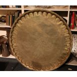 A large Islamic brass circular tray, 98cm, a Cairo ware brass jardiniere, a Turkish coffee pot and a