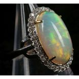 An 18ct white gold, cabouchon opal and diamond clu