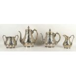 A 19th Century, silver plated and repoussé decorated four piece tea / coffee set with scroll handles