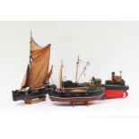 A model of a trawler, another and a boat