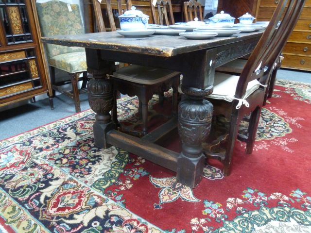 An Elizabethan style oak refectory table, the three-plank top on leaf carved rails and bulbous - Image 2 of 8