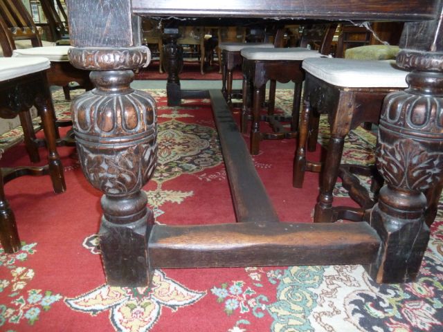 An Elizabethan style oak refectory table, the three-plank top on leaf carved rails and bulbous - Image 6 of 8