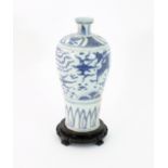 A Chinese blue and white Meiping vase painted with Ho Ho birds above a band of stiff leaves, Wanli