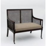 A George III mahogany two-seater bergère