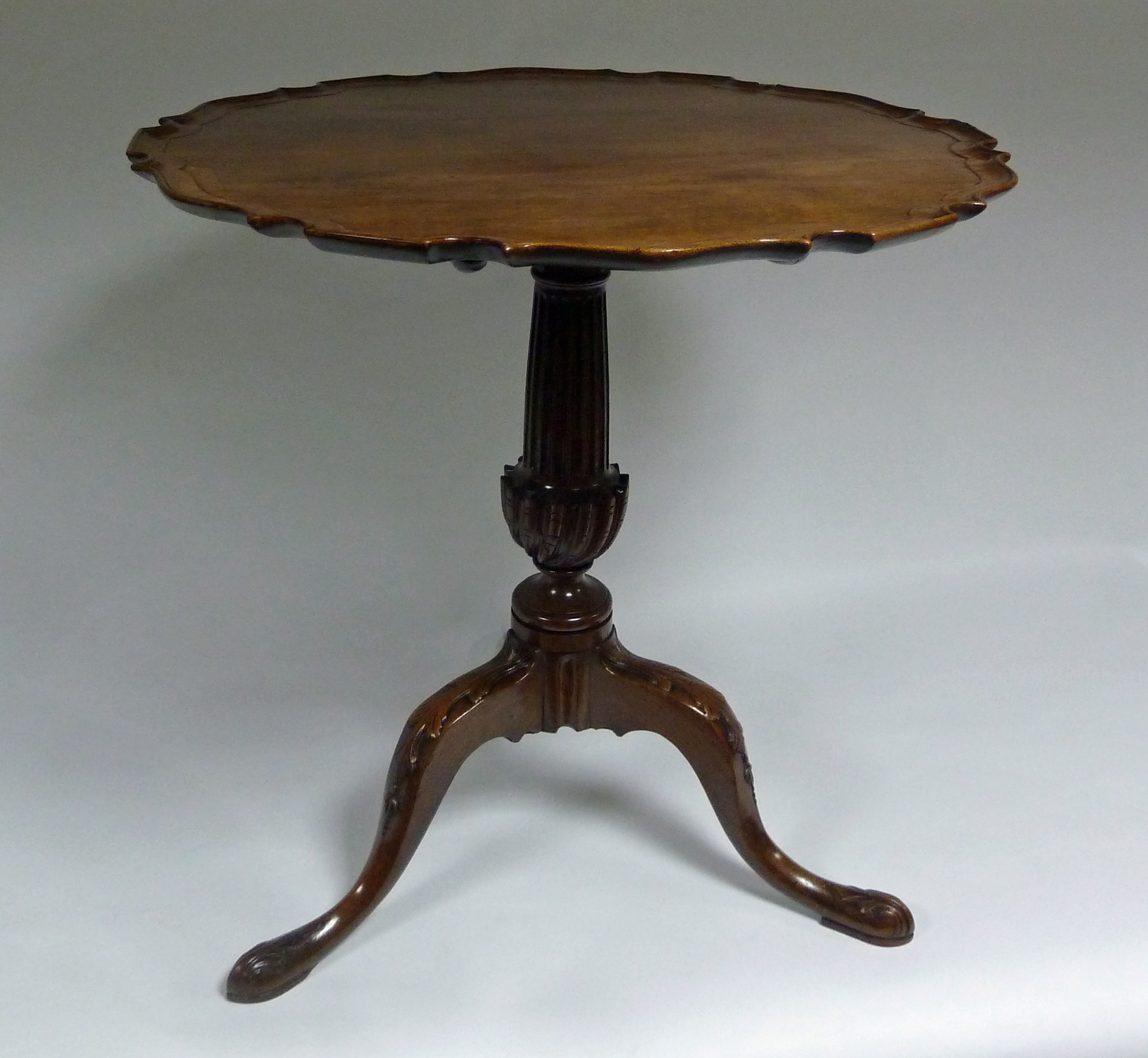 A George III mahogany tripod table, the