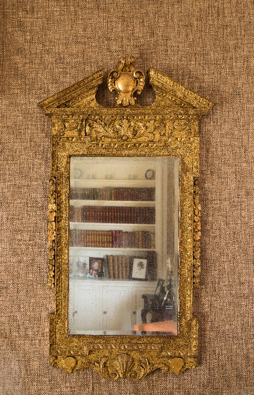 A George II carved gilt gesso wall mirro