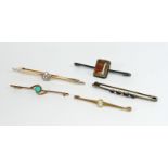 A collection of five bar brooches, inclu