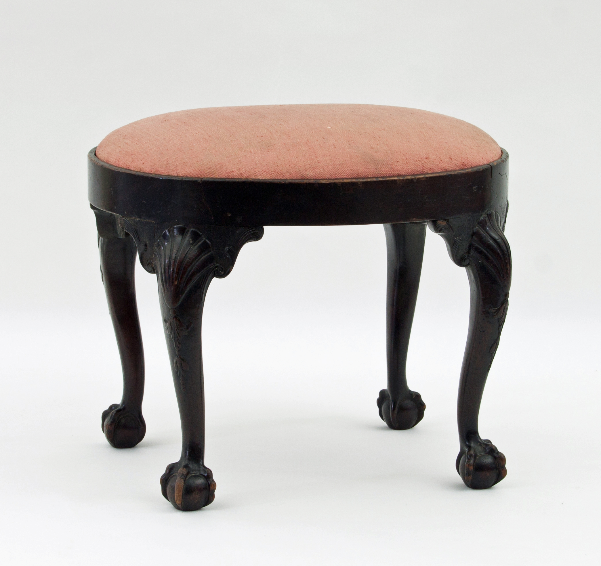 A George II style mahogany stool, of ova