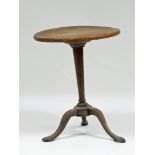 A mahogany tripod table, the base 18th Century, the circular top later, 50cm diameter Condition