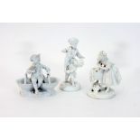 Three white glazed porcelain figures, va