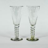 A pair of large glass champagne flutes w