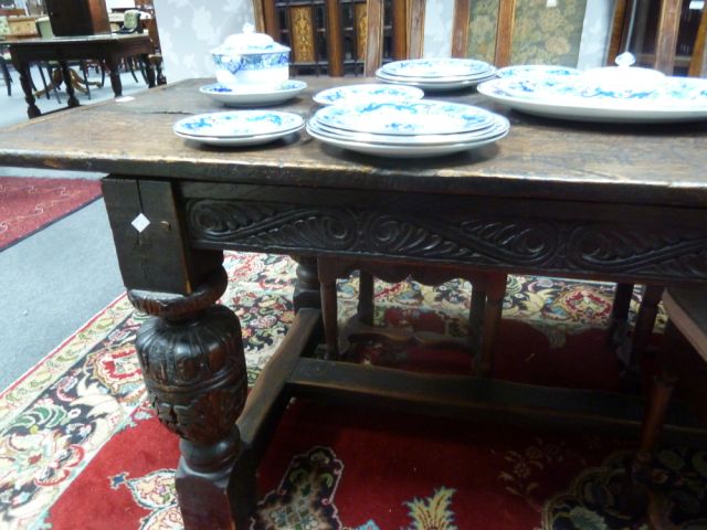An Elizabethan style oak refectory table, the three-plank top on leaf carved rails and bulbous - Image 3 of 8