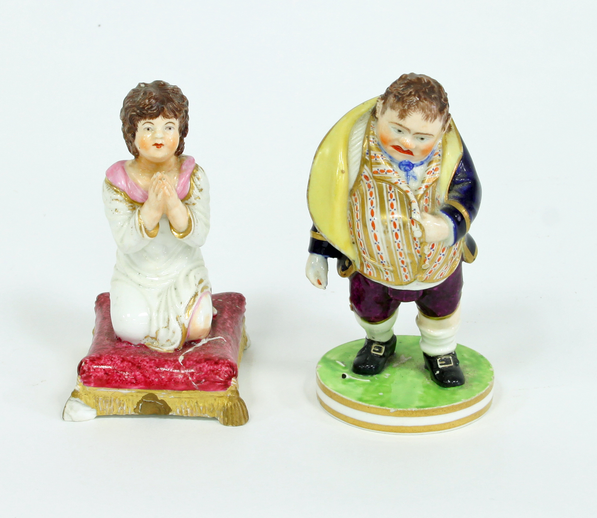A Bloor Derby figure of a toper and a model of a girl praying, circa 1830, the first with red