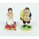 A Bloor Derby figure of a toper and a model of a girl praying, circa 1830, the first with red