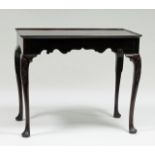 A George III mahogany silver table, probably Irish, the rectangular dished top with indented corners