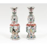 A pair of Chinese bottle vases, Kangxi circa 1700, of hexagonal baluster form, painted with panels