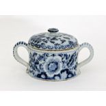 A Dutch delft blue and white posset and cover, early 18th Century, painted with flowers, 24cm