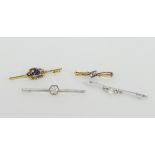 A collection of four bar brooches includ