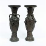 A pair of bronzed metal vases with birds