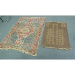 Two Eastern rugs, both worn