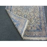 An Oriental rug with blue star medallion