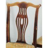 Four mahogany dining chairs with pierced