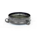 A Tudric pewter bowl, chased with floral designs, on three loop feet, 29cm high Condition Report: