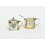 A drum shaped silver mustard pot, London 1829, 10cm high, with spoon and another with domed lid,