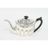 A silver teapot, London 1804, of oval fo