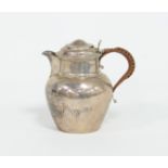 A silver lidded milk jug circa 1800 (mar