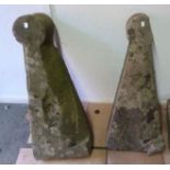 A pair of buttress capping stones with r
