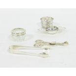 A silver tea strainer and stand, EV, She