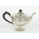 A silver teapot, Sheffield 1909, of circ