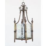An engraved glass and brass hall lantern of square section, supported on four scrolling arms, 78cm