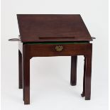 A George III mahogany architect's table, circa 1750, with hinged top, the book rest with fitted