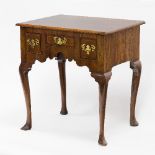 A George I walnut three-drawer side-table, with shaped apron on cabriole legs, 65cm wide/see