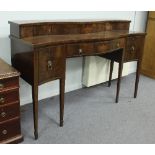 A George III style mahogany serpentine sideboard, inlaid an urn, on six square tapering legs with