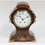 An Edwardian inlaid cased mantel clock, the white enamel dial with Arabic numerals signed Simmons,